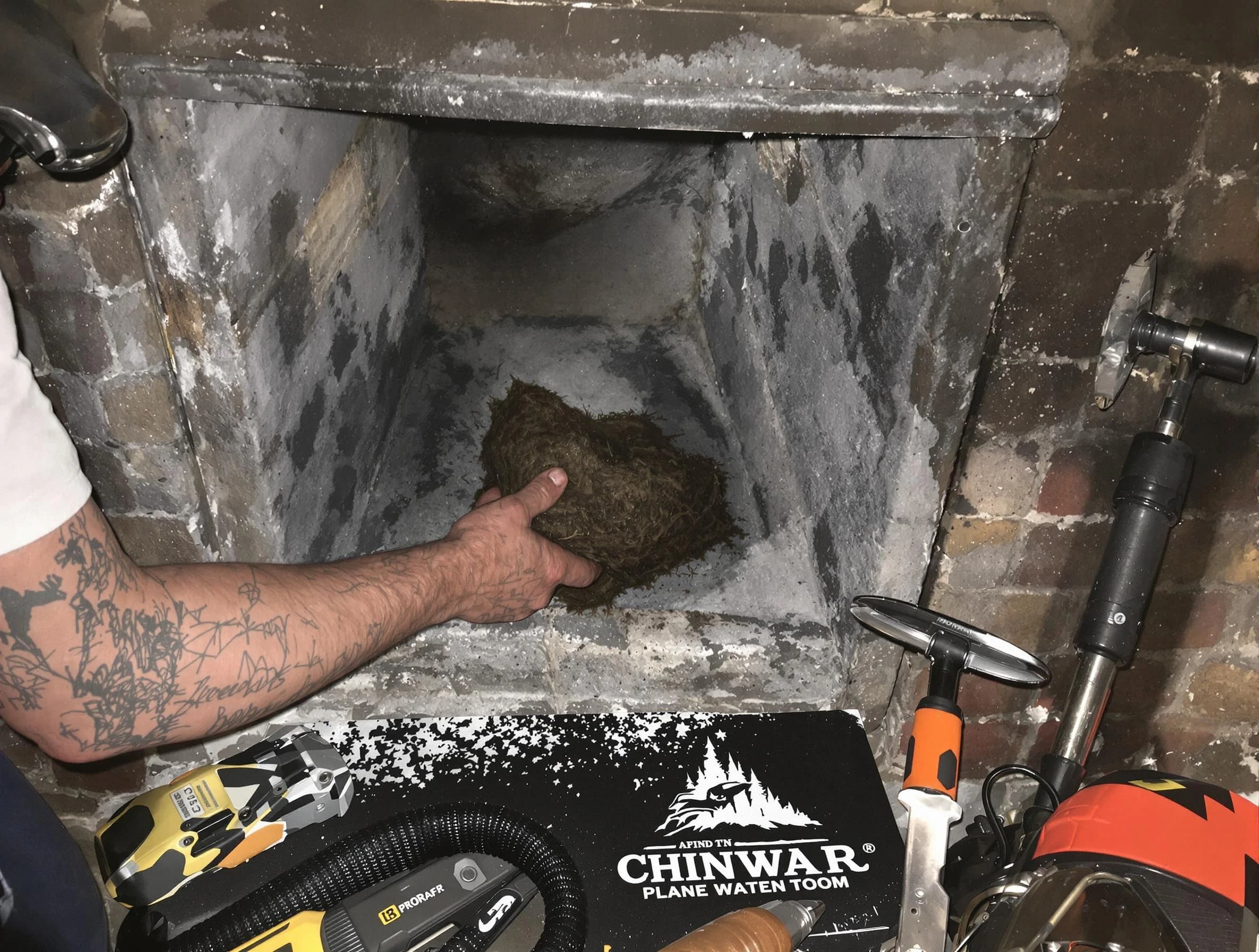 Tucker Chimney Sweep safely removing debris and screening chimney in Tucker, GA